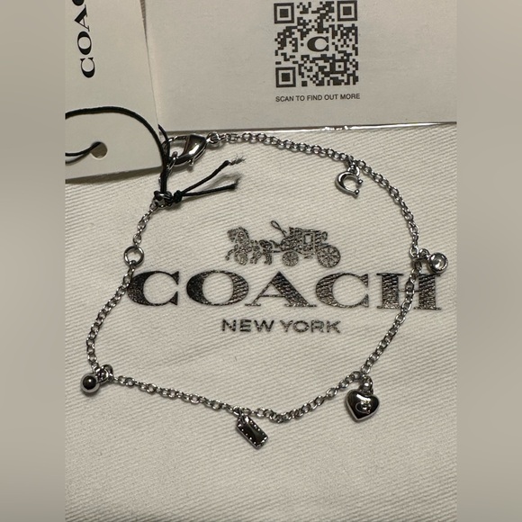 Coach New NWT silver tone chain charm bracelet featuring multiple charms - Picture 3 of 5